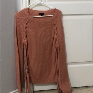 A long sleeve crewneck sweater